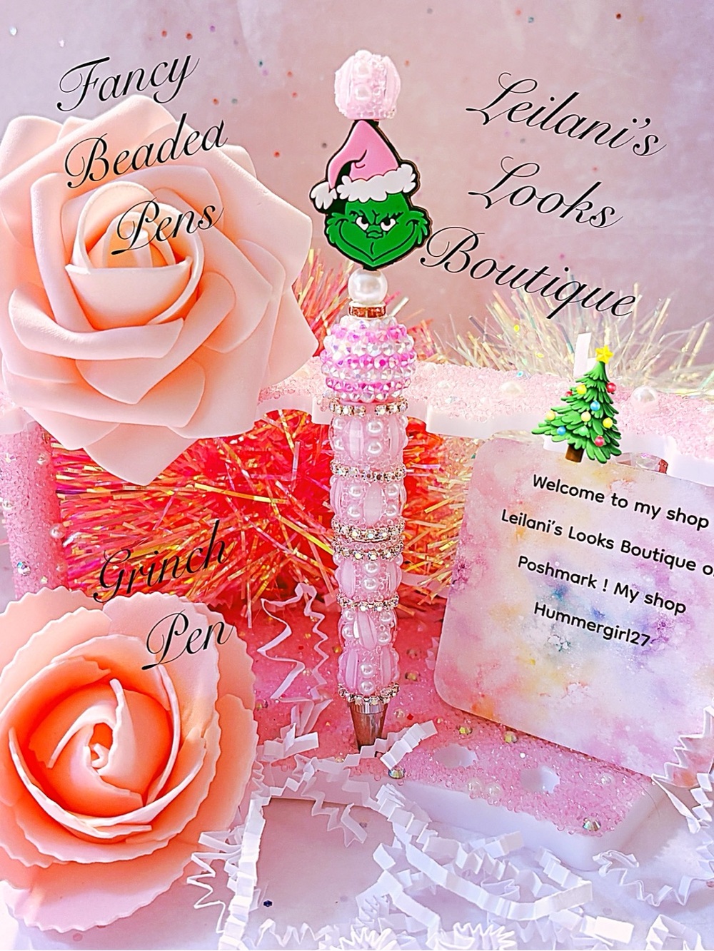 Pink Grinch beaded pen with rhinestones and a green Grinch face wearing a Santa